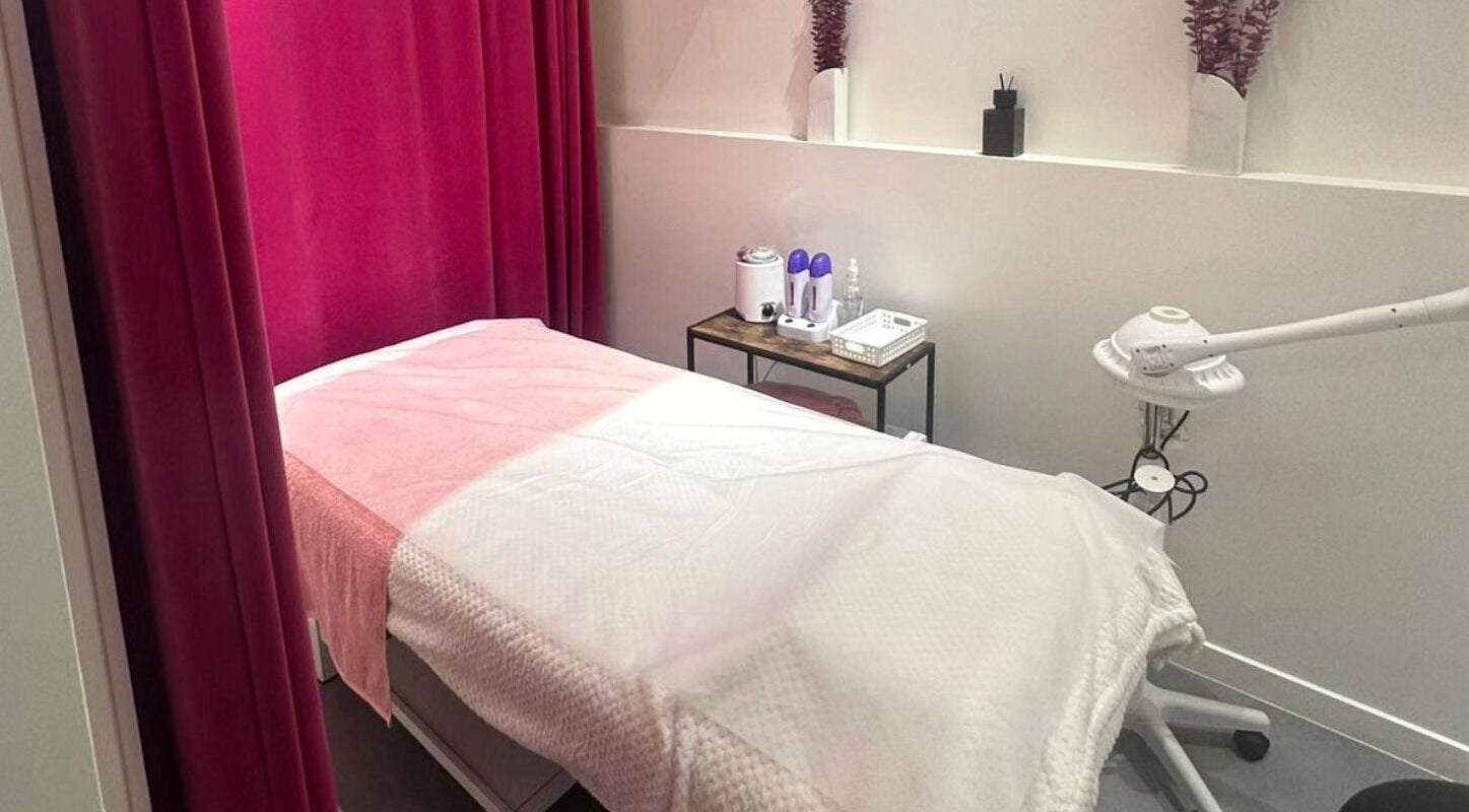 Relaxing treatment room at Vish Beauty Bar Dunedin, Dunedin, Otago, NZ, featuring a cozy massage table.