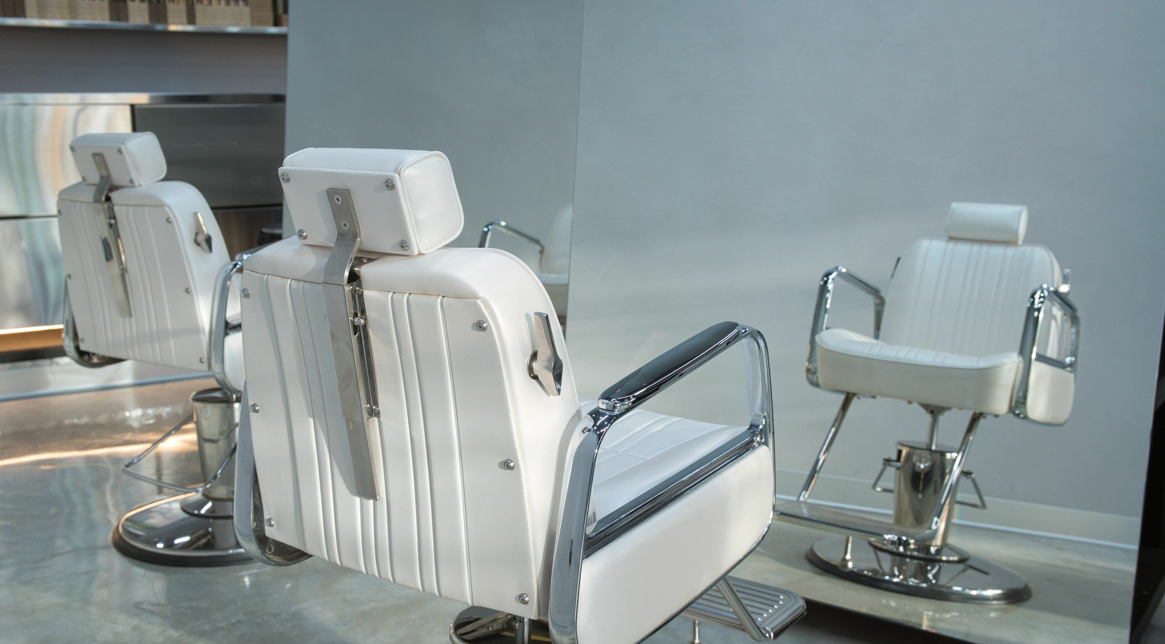 Modern salon chairs at Testa Studio Hair Artisan, Melbourne, Victoria, AU, reflecting luxury and comfort.