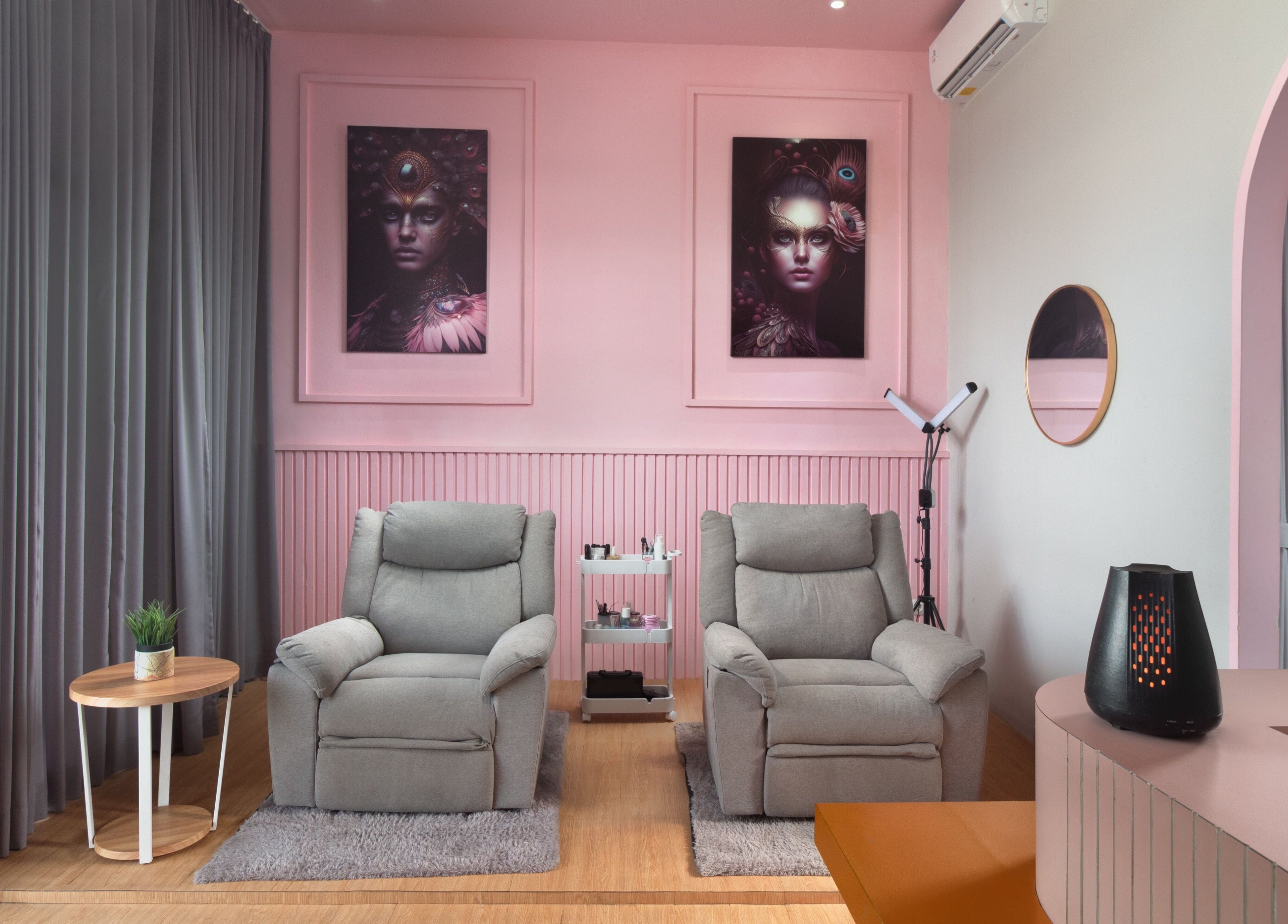 Cozy spa chairs at Misstia Beauty, Bali, Bali, ID with soft pink decor and elegant artwork.