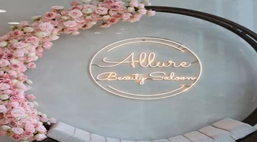 Allure Beauty Center logo with floral decor in Abu Dhabi, AE, showcasing a welcoming beauty ambiance.