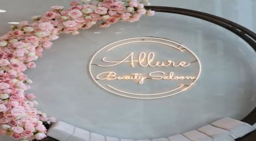 Allure Beauty Center logo with floral decor in Abu Dhabi, AE, showcasing a welcoming beauty ambiance.