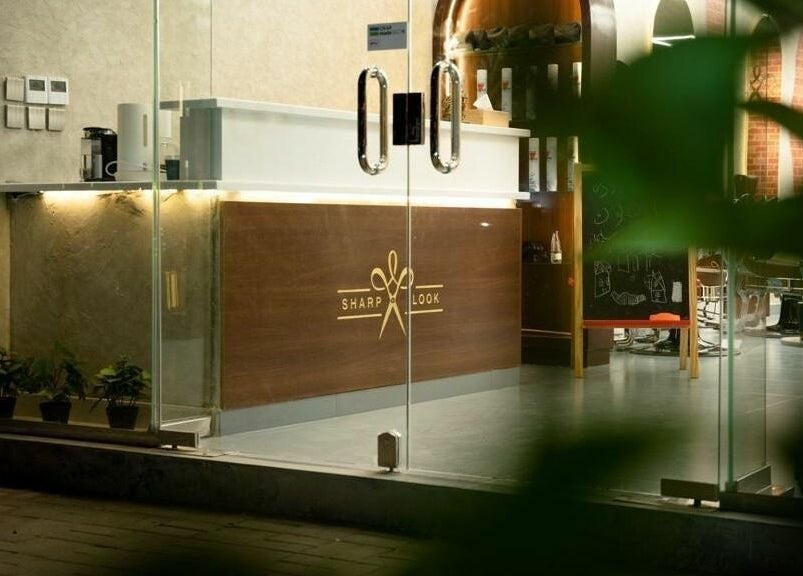 Sophisticated entrance of شارب لوك حطين - Sharp Look Hittin, Riyadh, Riyadh Province, SA with sleek glass doors.