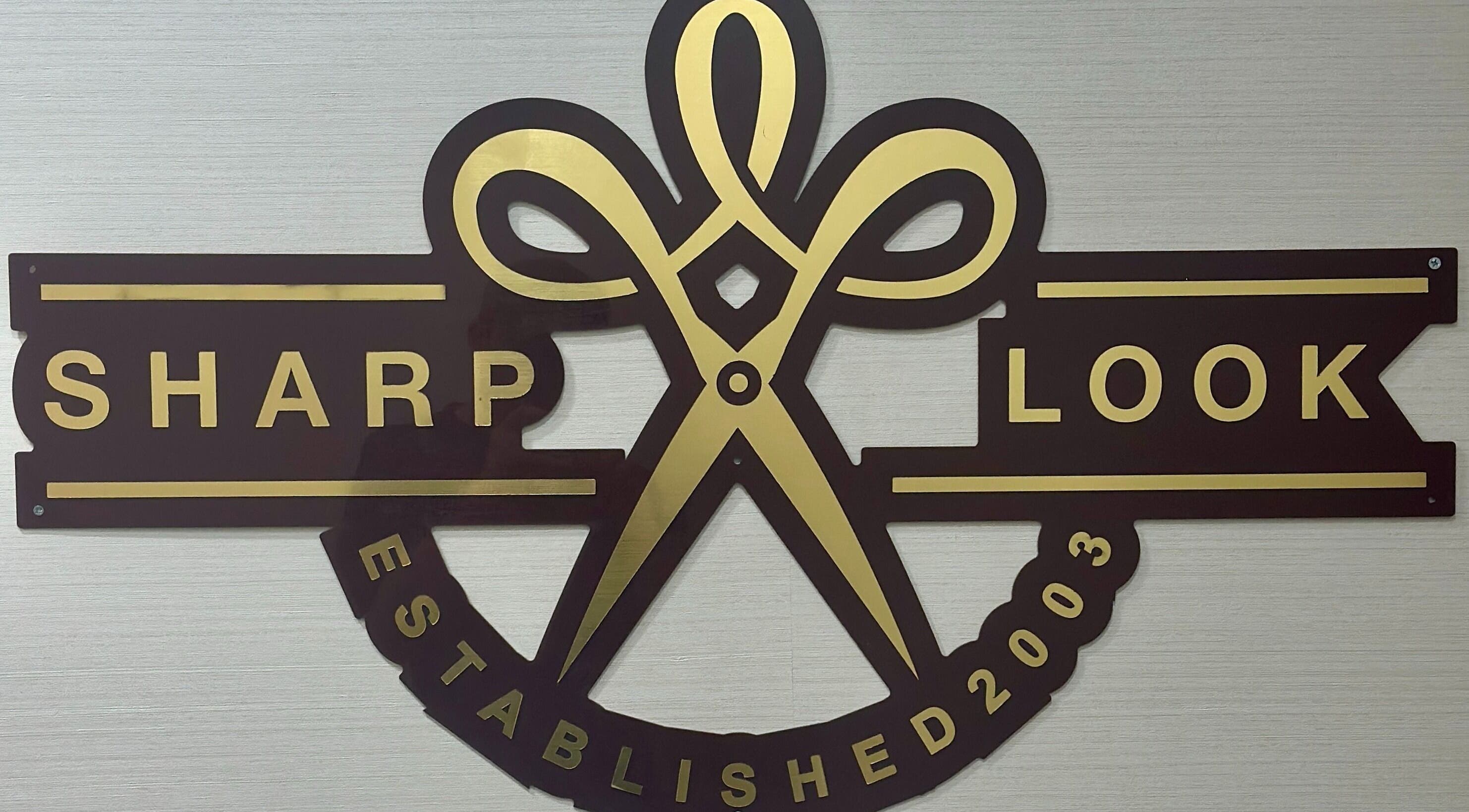 Sharp Look | Hilton Olaya sign at الرياض, منطقة الرياض, SA, featuring stylish scissors logo.