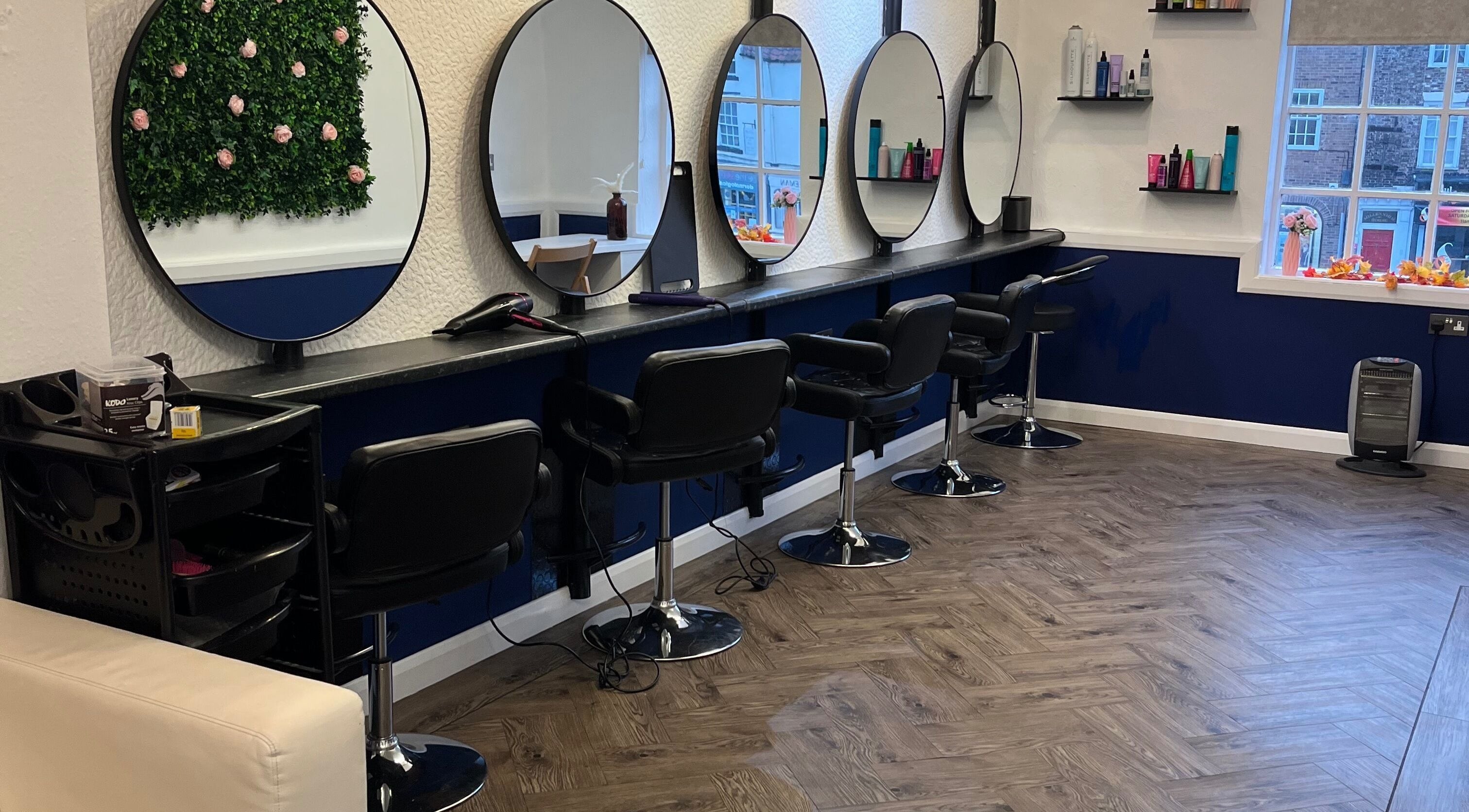 Interior of Chicago’s Hair Limited, Yarm, England, GB showcasing stylish salon mirrors and seating.