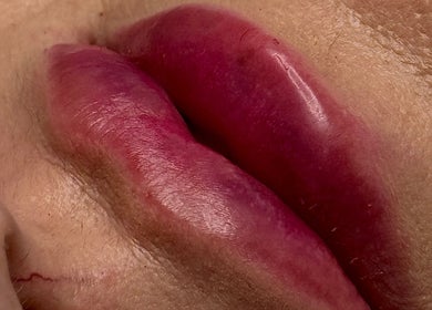 Close-up of vibrant, expertly colored lips at Paradox Aesthetics, Worcester, England, GB.