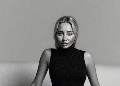 Woman in black turtleneck, Paradox Aesthetics, Worcester England, GB.