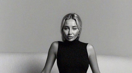 Woman in black turtleneck, Paradox Aesthetics, Worcester England, GB.