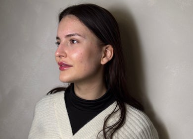 Close-up portrait of woman with glowing skin at Paradox Aesthetics, Worcester, England, GB.