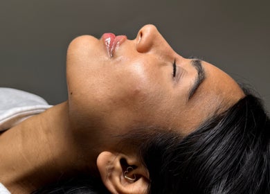 Relaxed person with glowing skin at Paradox Aesthetics in Worcester, England, GB.