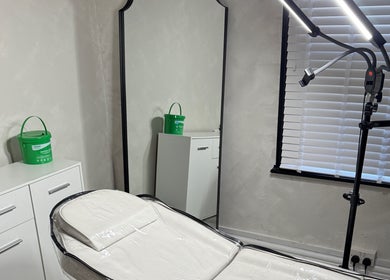 Sleek treatment room at Paradox Aesthetics, Worcester, England, GB, featuring modern equipment and decor.