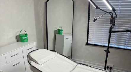 Sleek treatment room at Paradox Aesthetics, Worcester, England, GB, featuring modern equipment and decor.