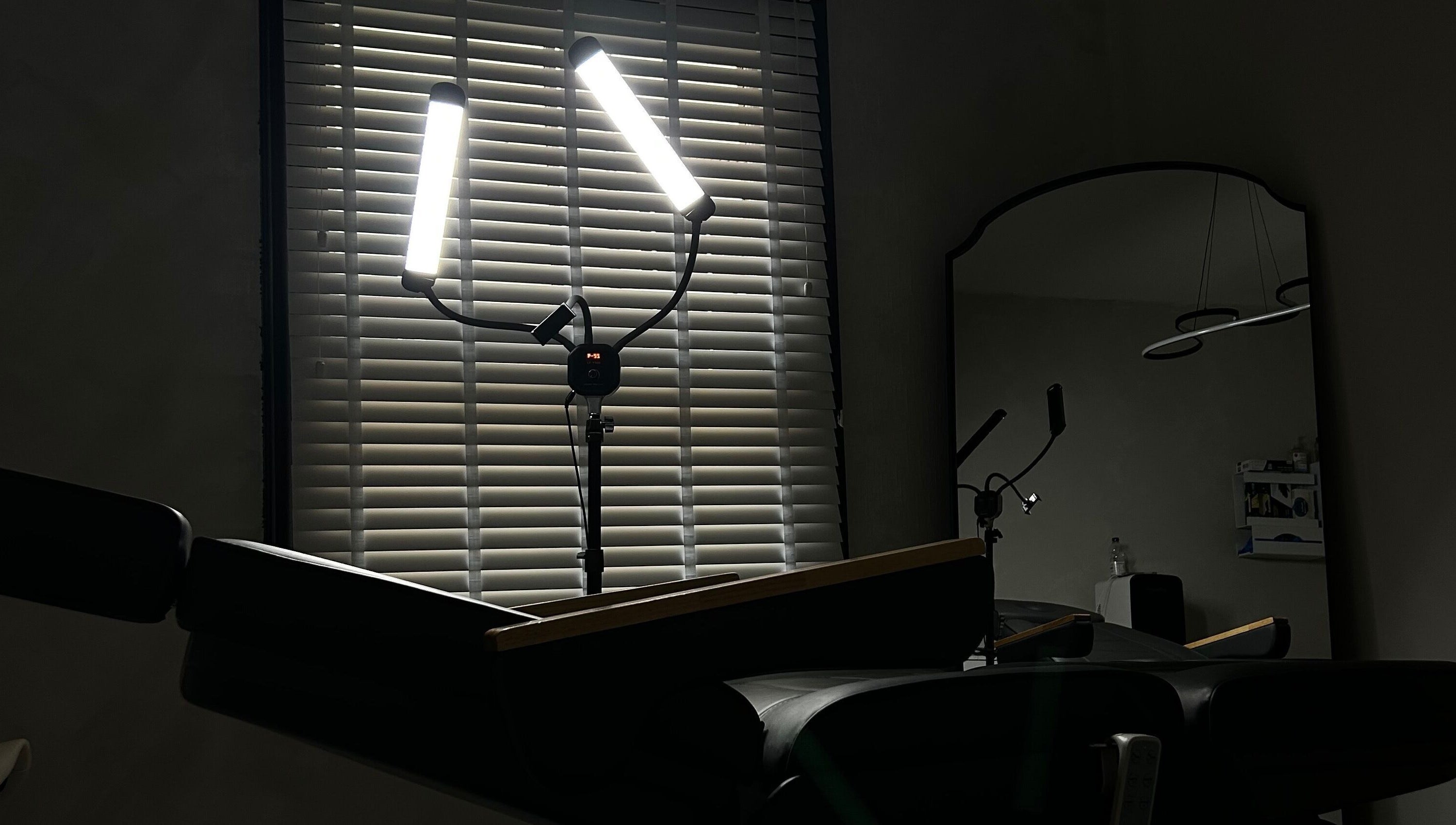 Treatment room at Paradox Aesthetics, Worcester, England with soft lighting and reclining chair.