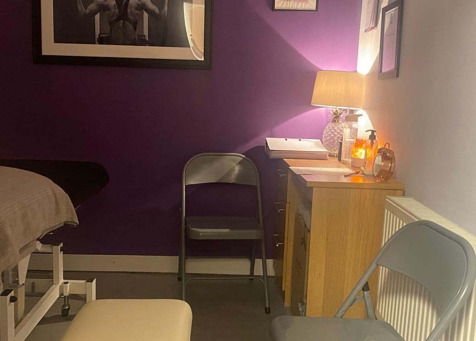 Cozy treatment room at Molly Sports Massage at Locker 27, Addlestone, England, GB, featuring a massage table.