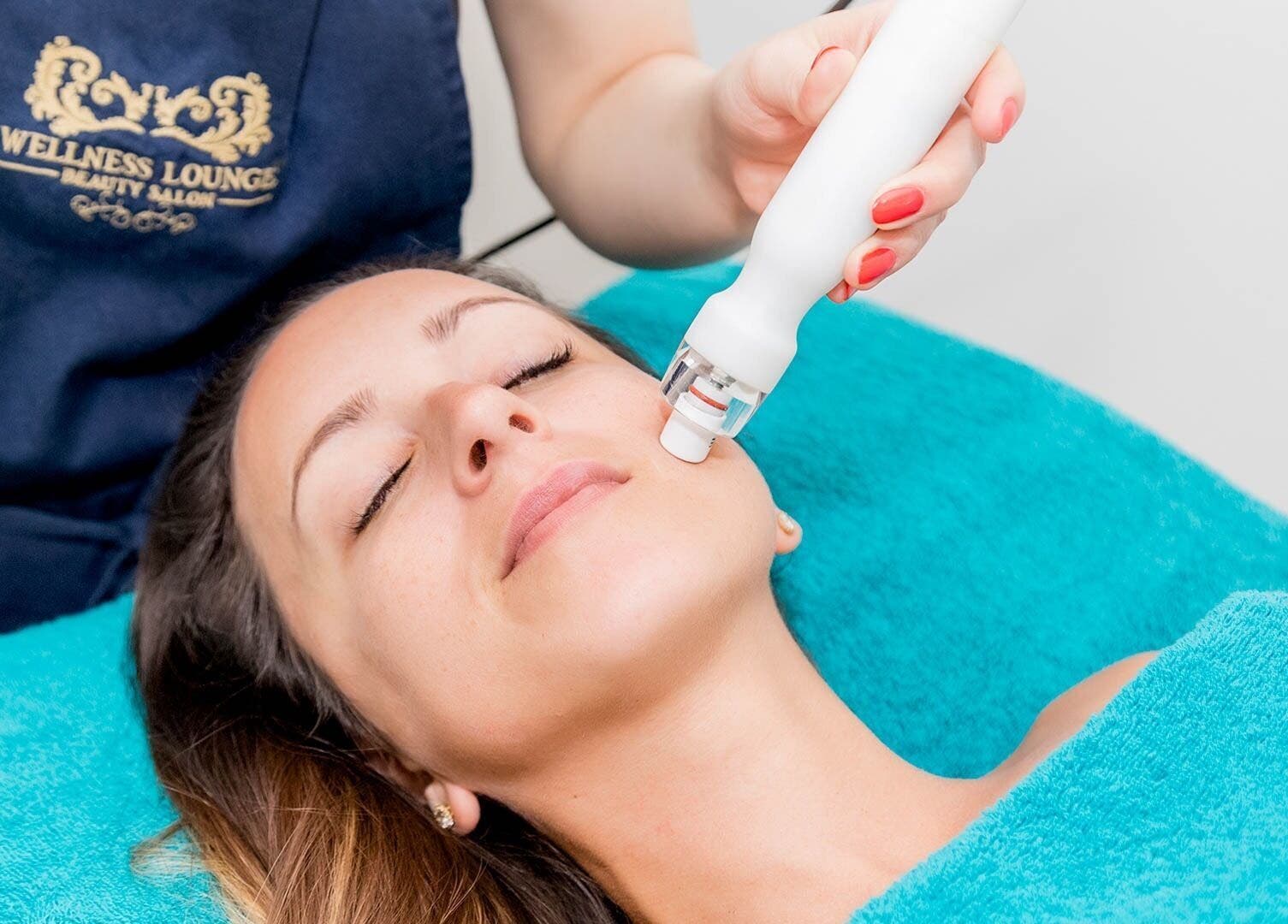 Facial treatment at Wellness Lounge, London, England, GB, showcasing serene skincare service.