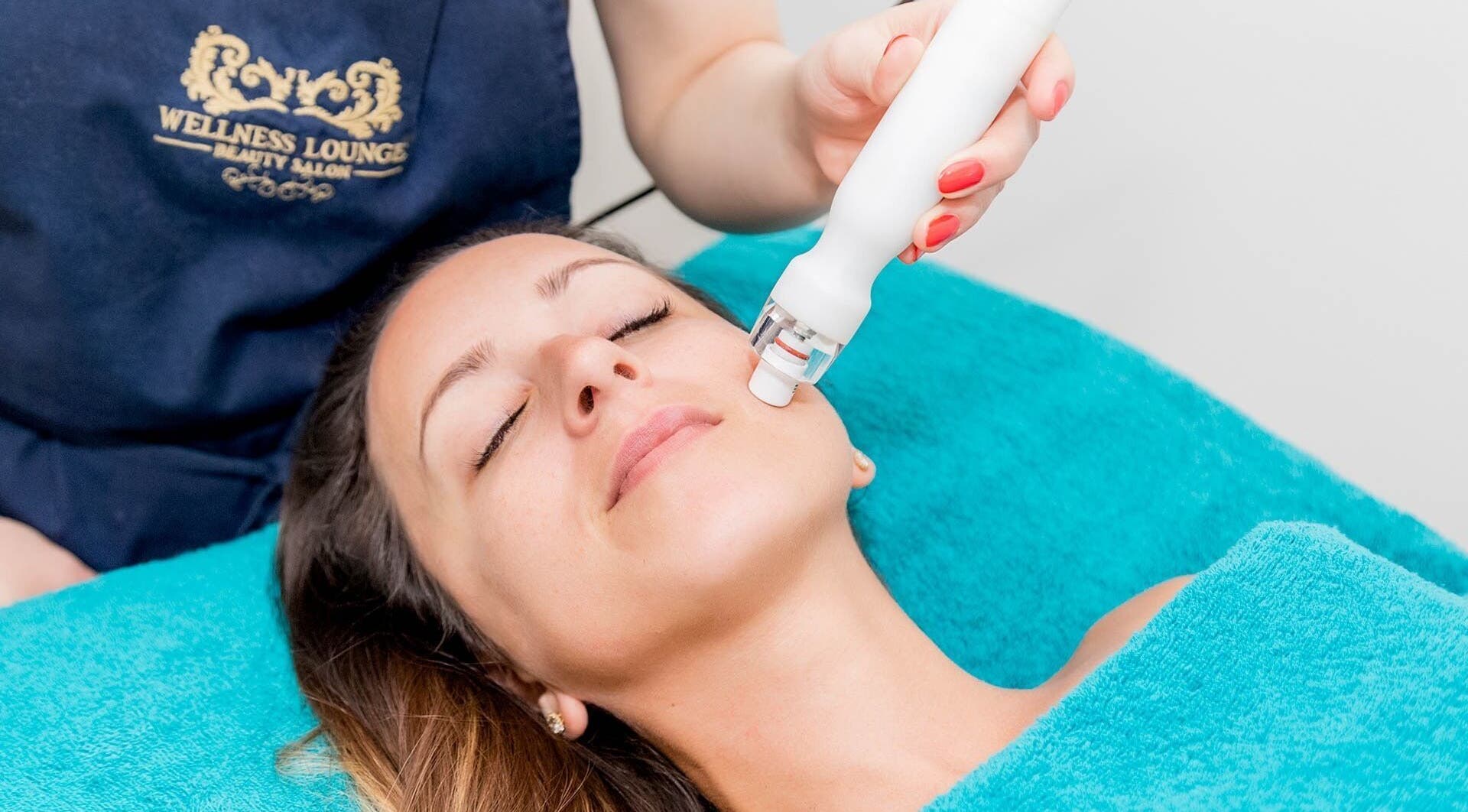 Facial treatment at Wellness Lounge, London, England, GB, showcasing serene skincare service.