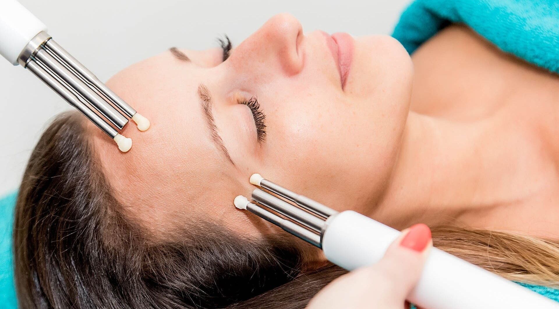 Relaxing facial treatment at Wellness Lounge, London, England, GB, featuring advanced skincare technology.