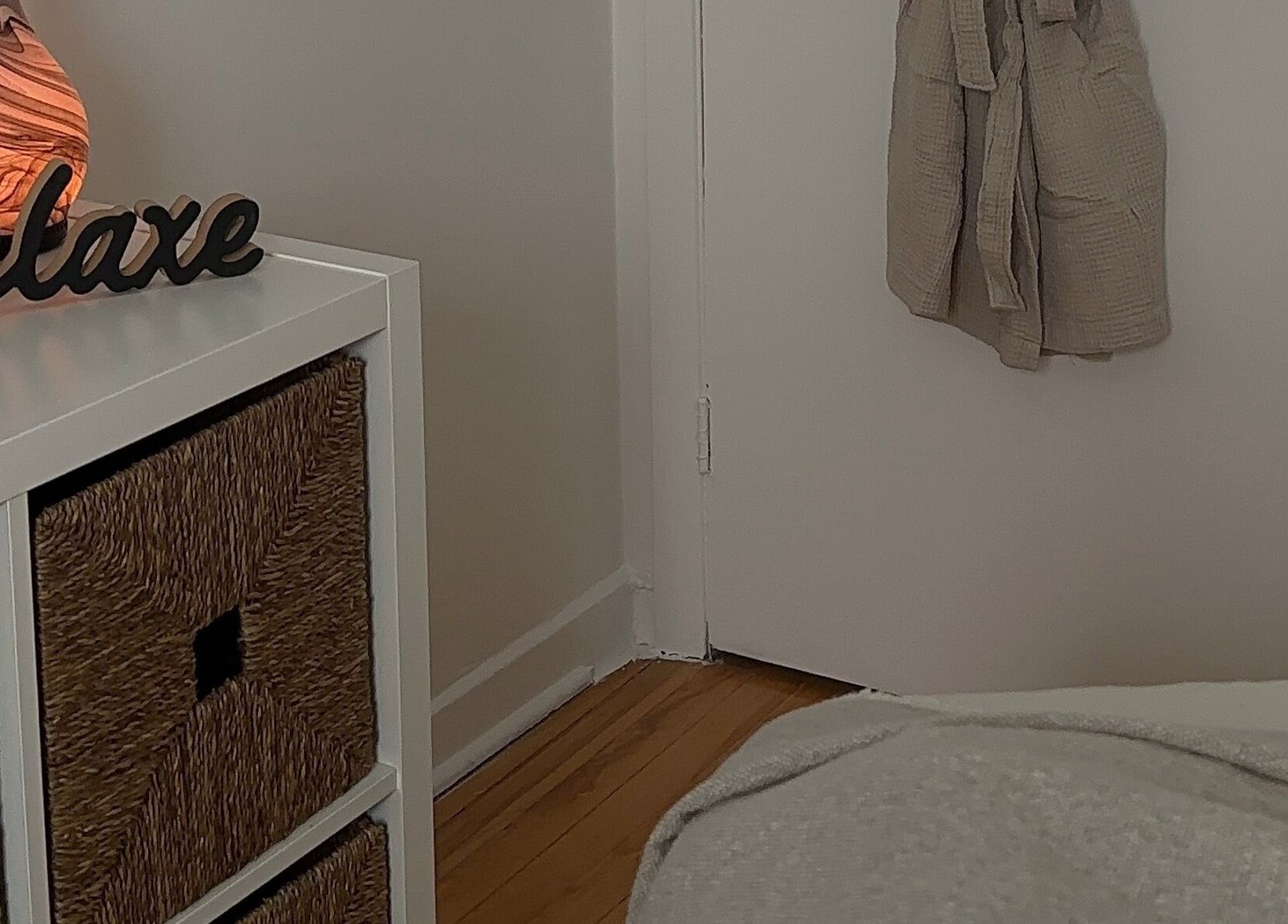 Cozy corner with 'Relax' sign at Art by Douja, Montréal, Québec, CA promoting tranquility.