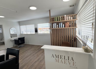 Inside view of Amelia Maeve Hair, Blenheim, Marlborough Region, NZ with chic decor and styling stations.