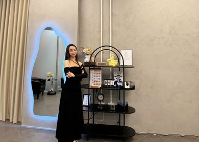 Elegant display at Moon Artistry Canterbury, New South Wales, AU with a stylish woman in black dress.