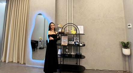 Elegant display at Moon Artistry Canterbury, New South Wales, AU with a stylish woman in black dress.