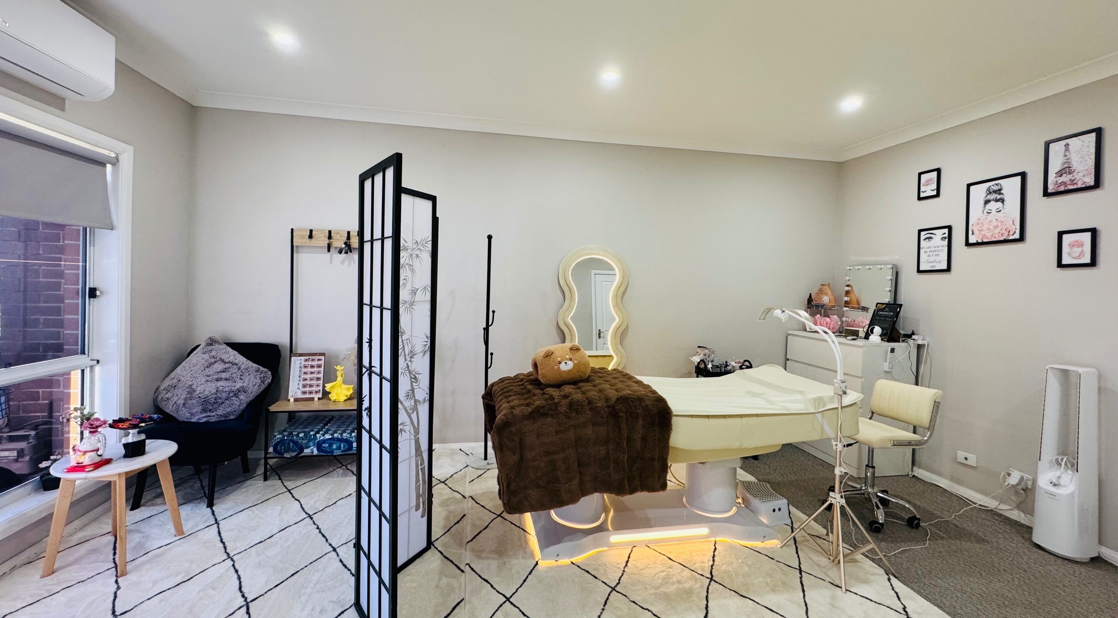 Relaxing beauty room at Moon Artistry Canley Vale, Canley Vale, New South Wales, AU with elegant decor and treatment bed.