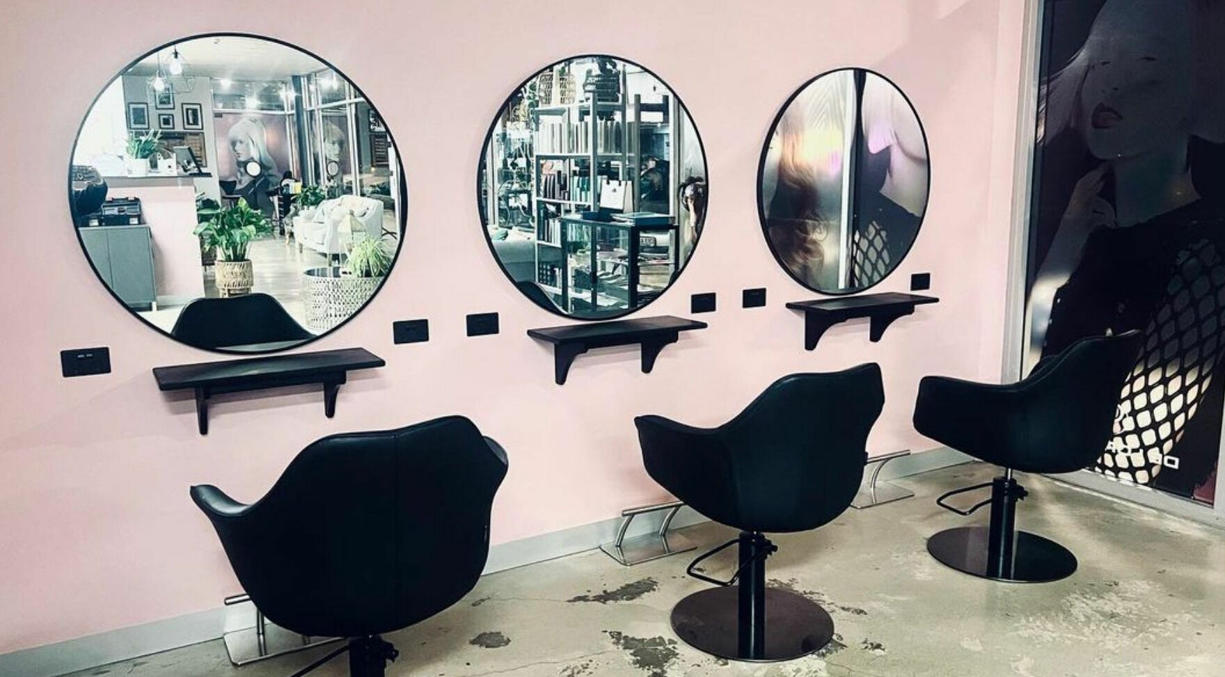Modern salon interior of Longko Salon in Mawson Lakes, South Australia, AU, featuring stylish mirrors and chairs.
