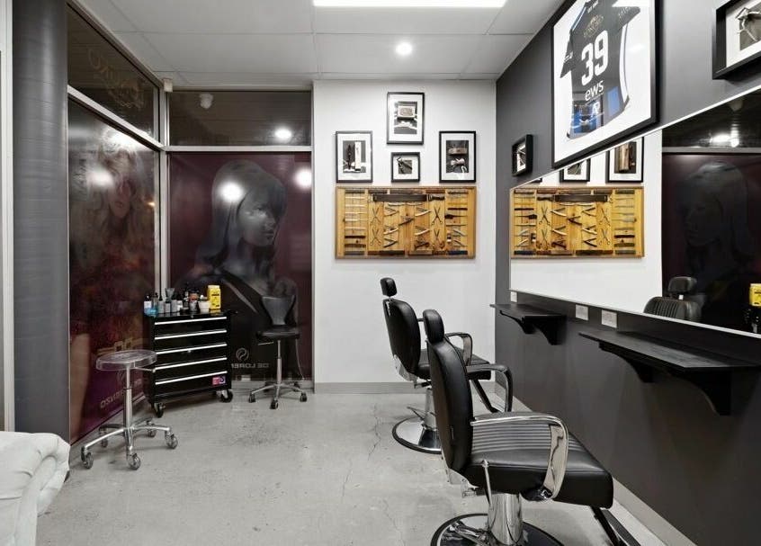 Modern styling chairs at Longko Salon, Mawson Lakes, South Australia, AU with elegant wall art.