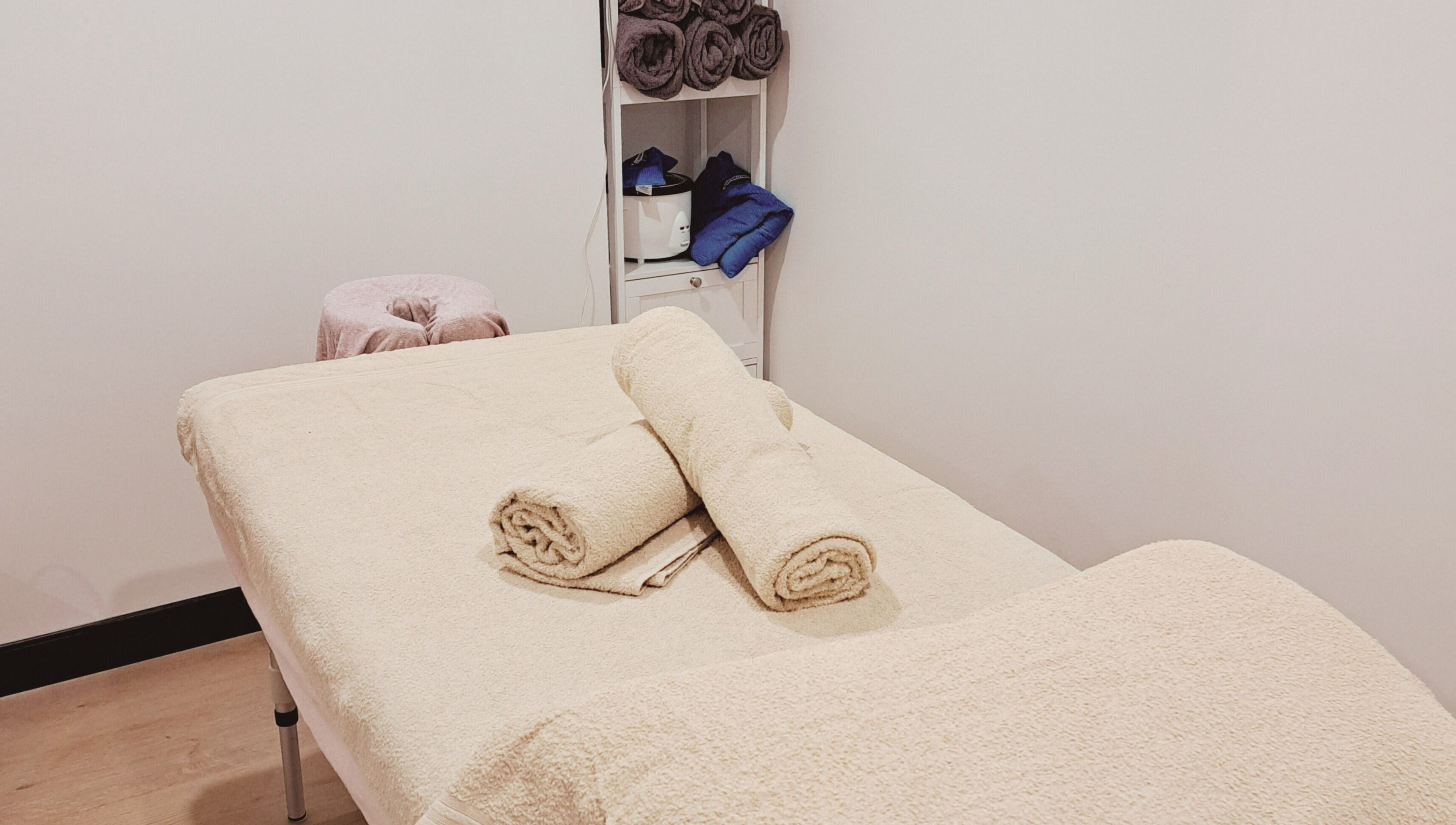 Serene massage room at The Hub Remedial Massage, Caringbah, New South Wales, AU with cozy linens and warm ambiance.