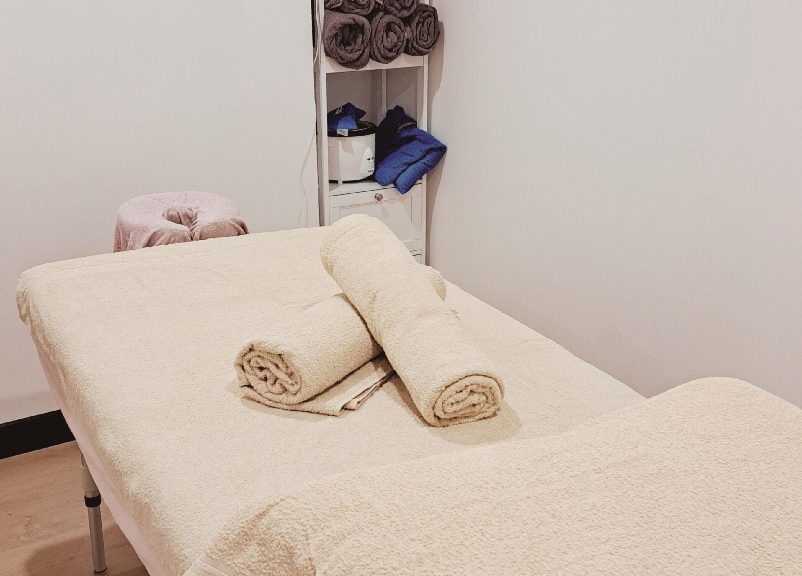 Serene massage room at The Hub Remedial Massage, Caringbah, New South Wales, AU with cozy linens and warm ambiance.