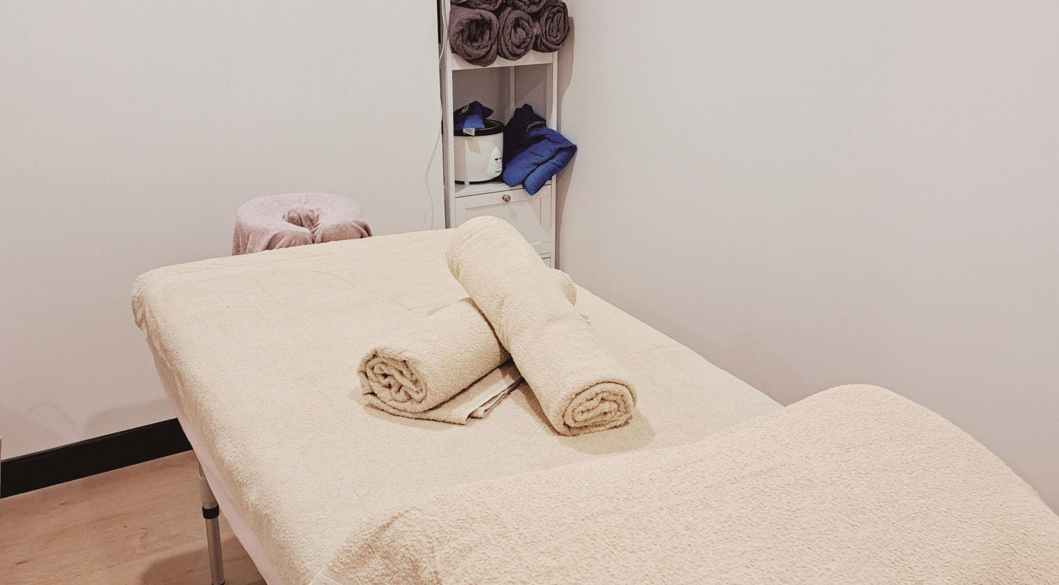 Serene massage room at The Hub Remedial Massage, Caringbah, New South Wales, AU with cozy linens and warm ambiance.