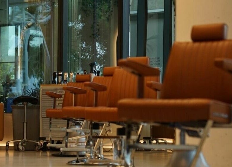 Luxurious hair salon chairs at Stallion, Maroochydore, QLD, AU showcasing modern decor.