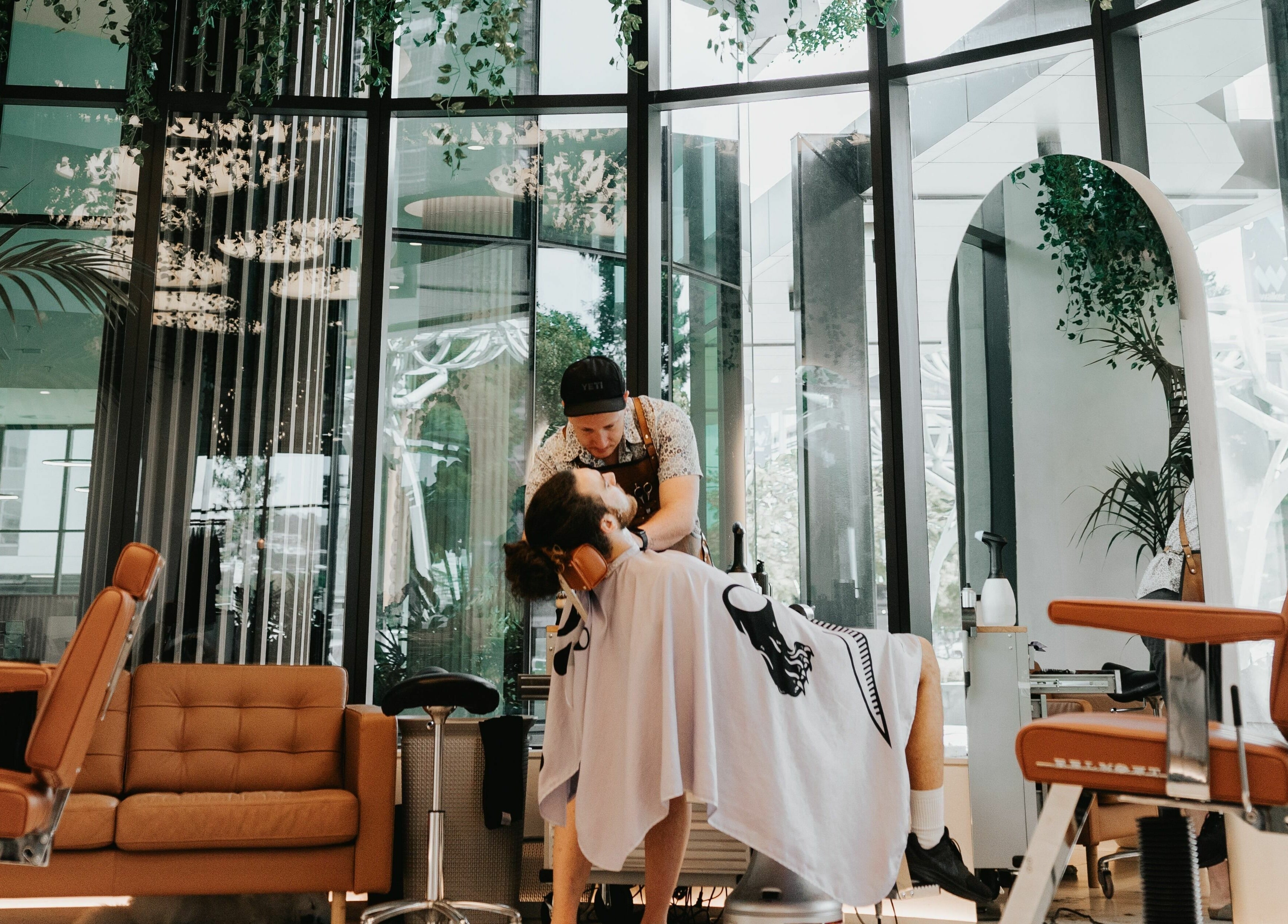 Professional hairstylist at Stallion in Maroochydore, QLD, AU offering a relaxing grooming experience.