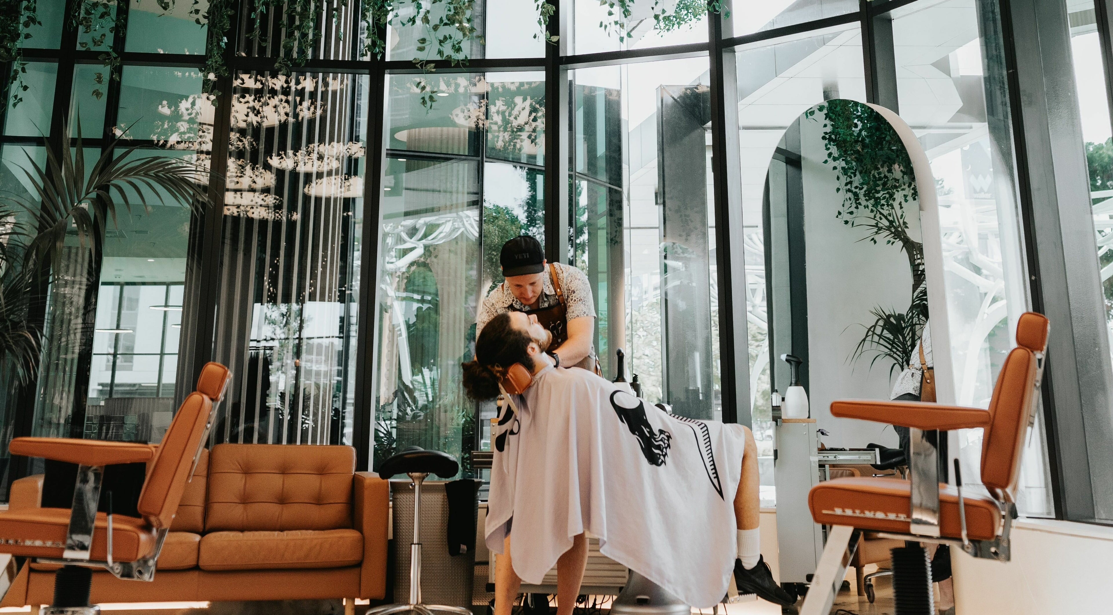 Professional hairstylist at Stallion in Maroochydore, QLD, AU offering a relaxing grooming experience.