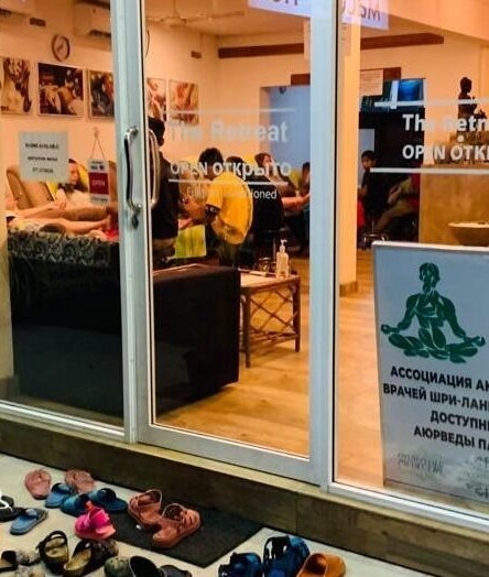 The Retreat in Hikkaduwa, Southern Province, LK, warmly lit entrance showcasing wellness services.