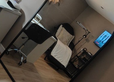 Spacious beauty room at The Cosmetic Lodge, Hull, England, GB featuring a treatment chair and stylish decor.