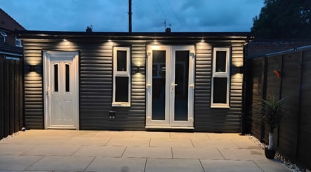 The Cosmetic Lodge at dusk in Hull, England, GB. Elegant facade with modern lighting and entrance.