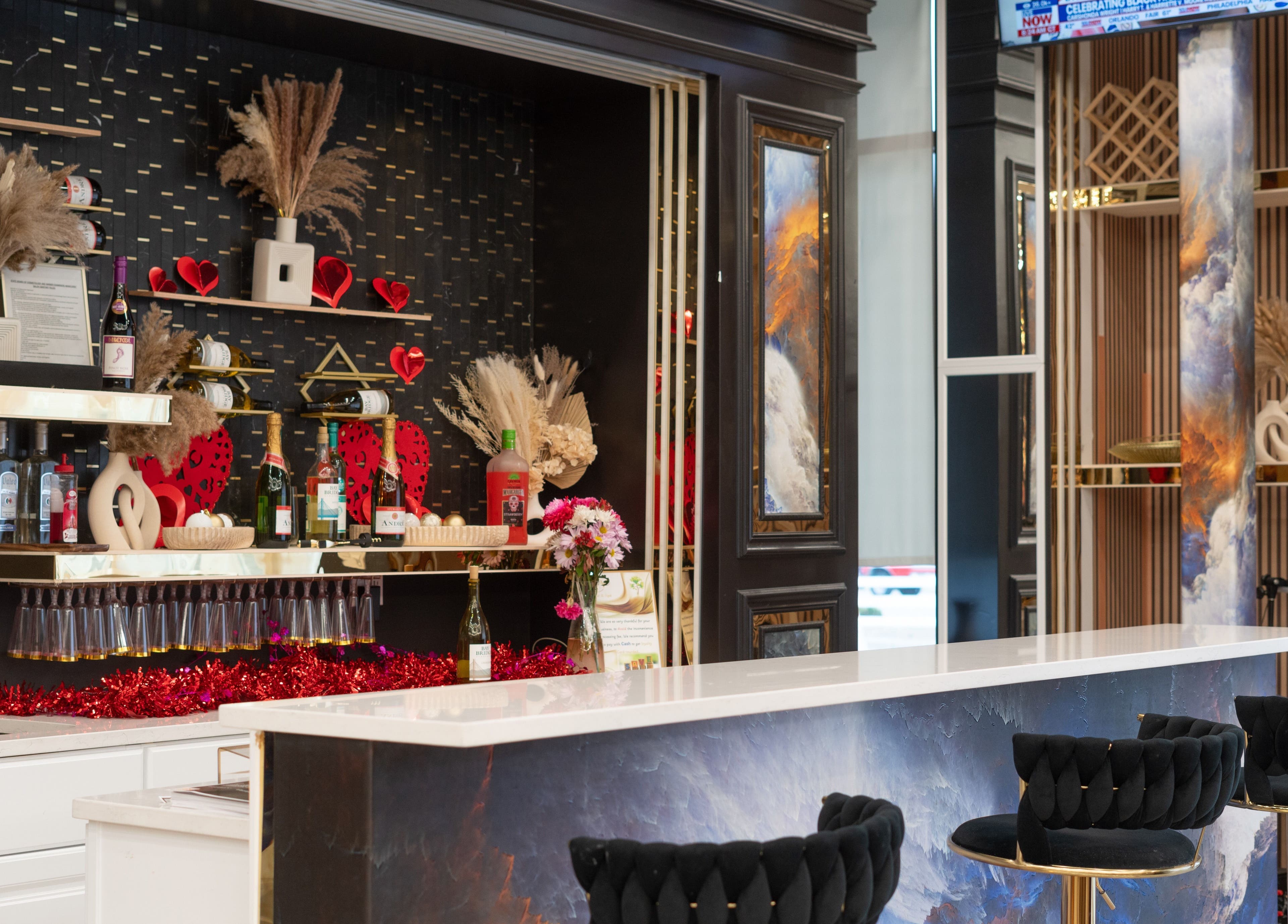 Elegant bar area at MV Nail Bar and Spa, Jeffersonville, Indiana, US with chic decor and stylish seating.