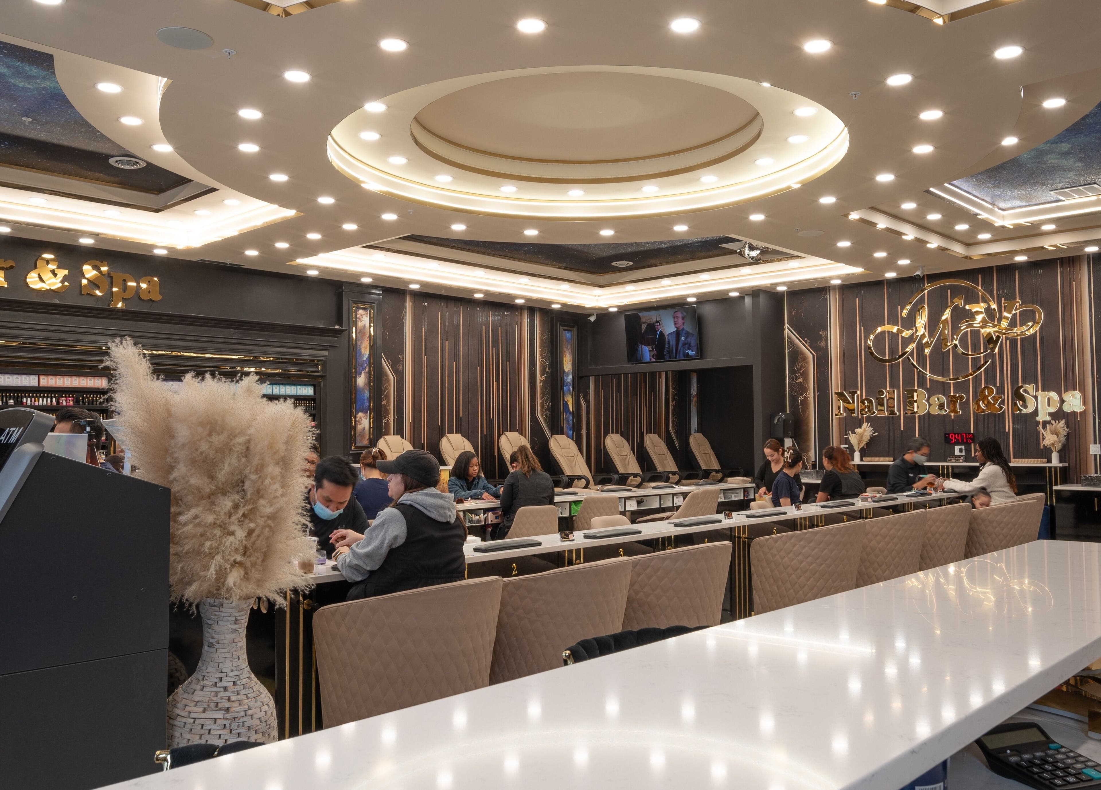 Inside MV Nail Bar and Spa in Jeffersonville, Indiana, US, showcasing elegant decor and pampering stations.