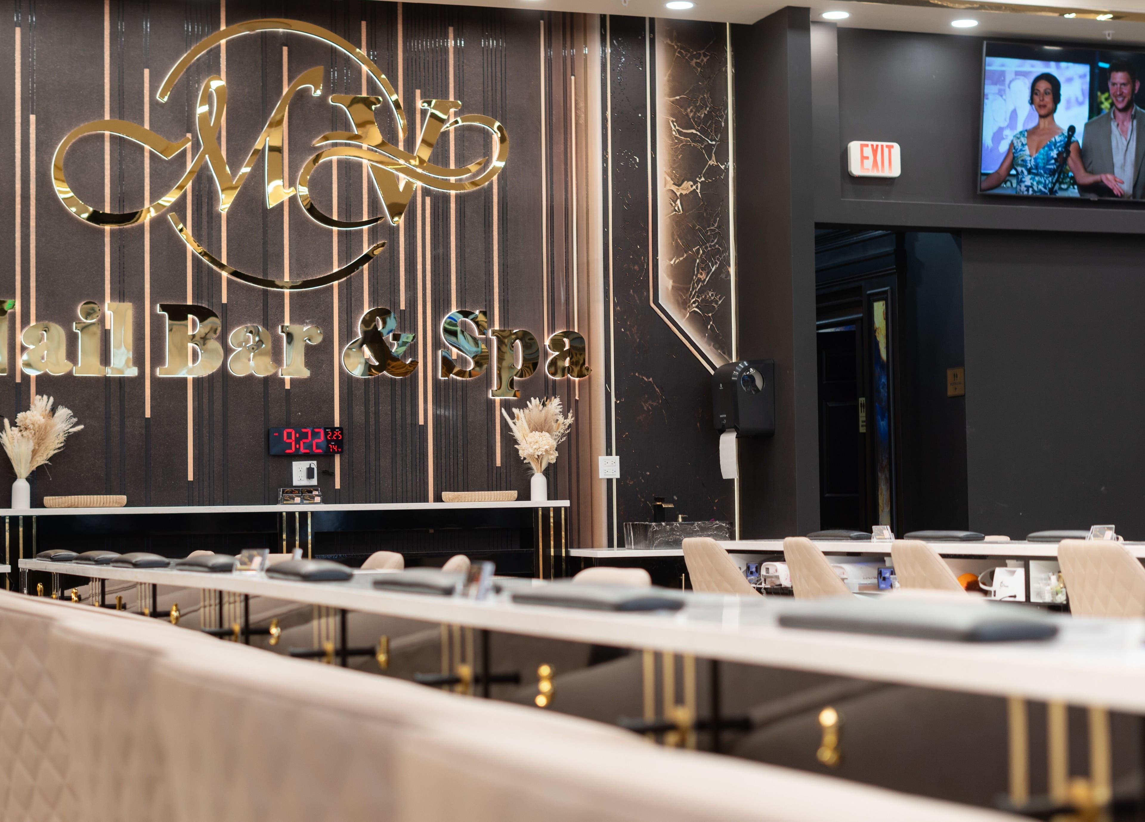 Stylish interior of MV Nail Bar and Spa in Jeffersonville, Indiana, US with luxurious seating and decor.