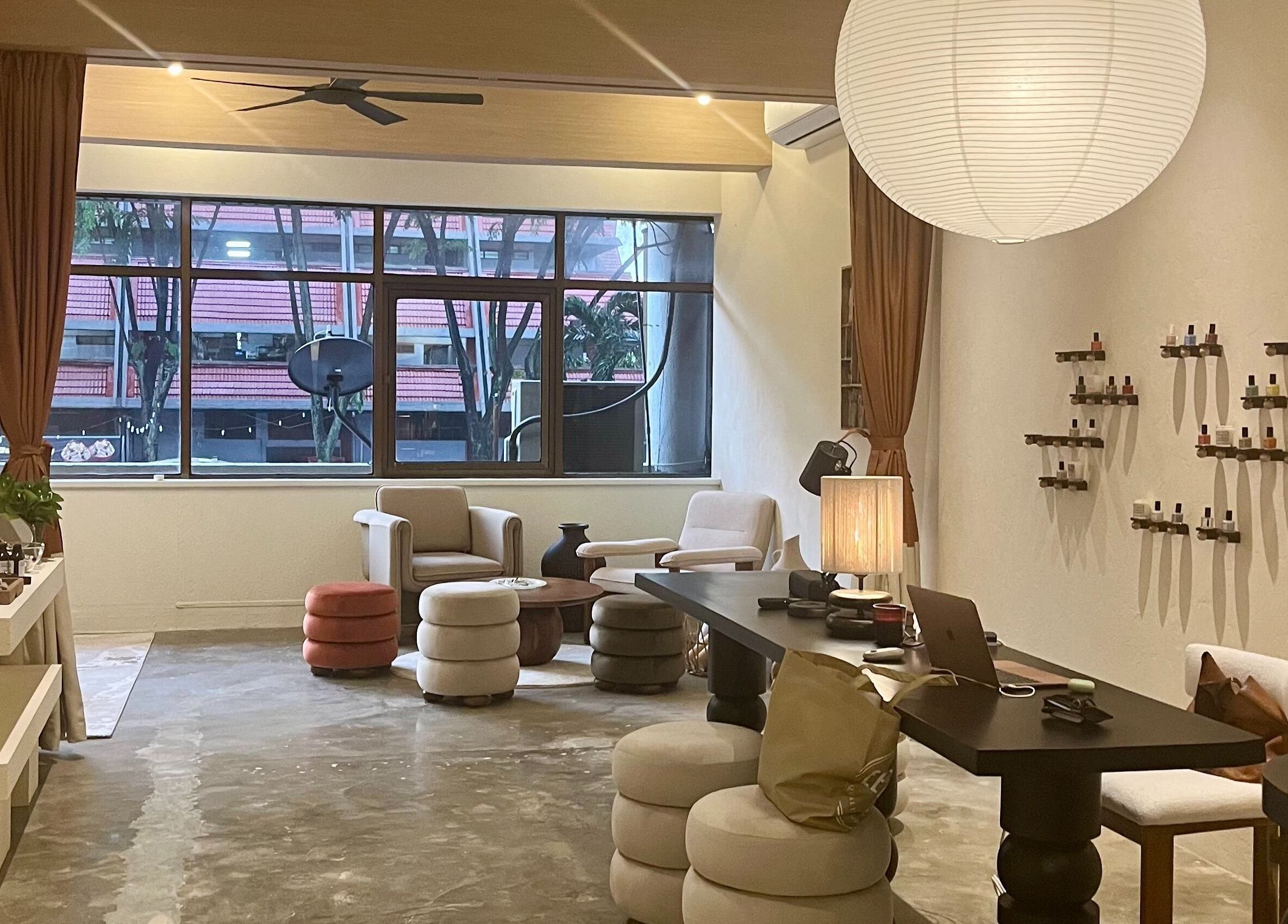 A cozy lounge at Honest Hour KL with modern decor in Kuala Lumpur, Wilayah Persekutuan Kuala Lumpur, MY.