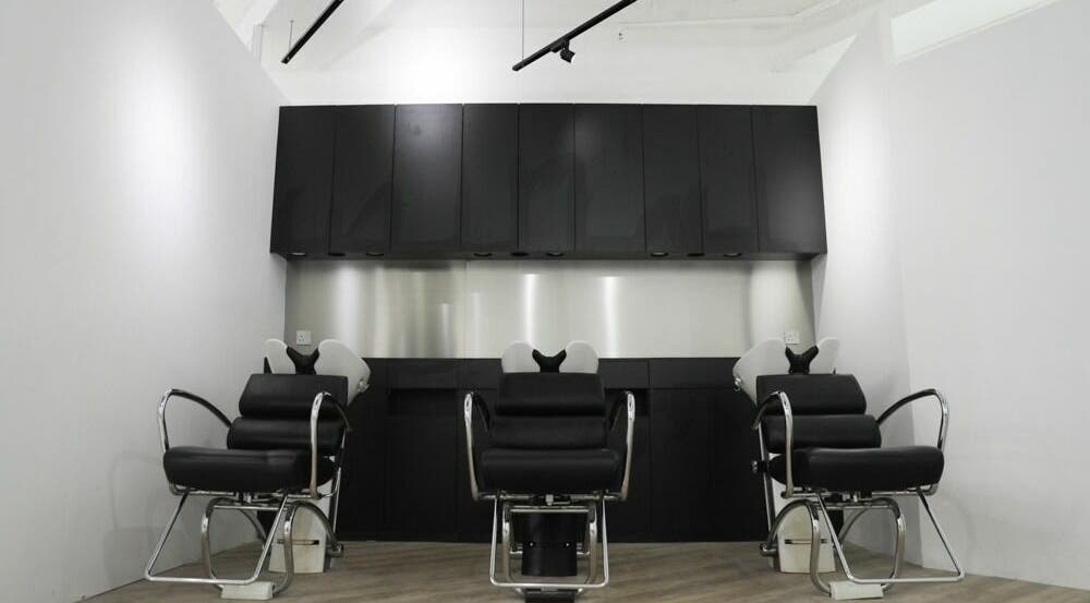 Modern salon seating at ASSORT HONG KONG on Hong Kong Island, HK, showcasing sleek black design.