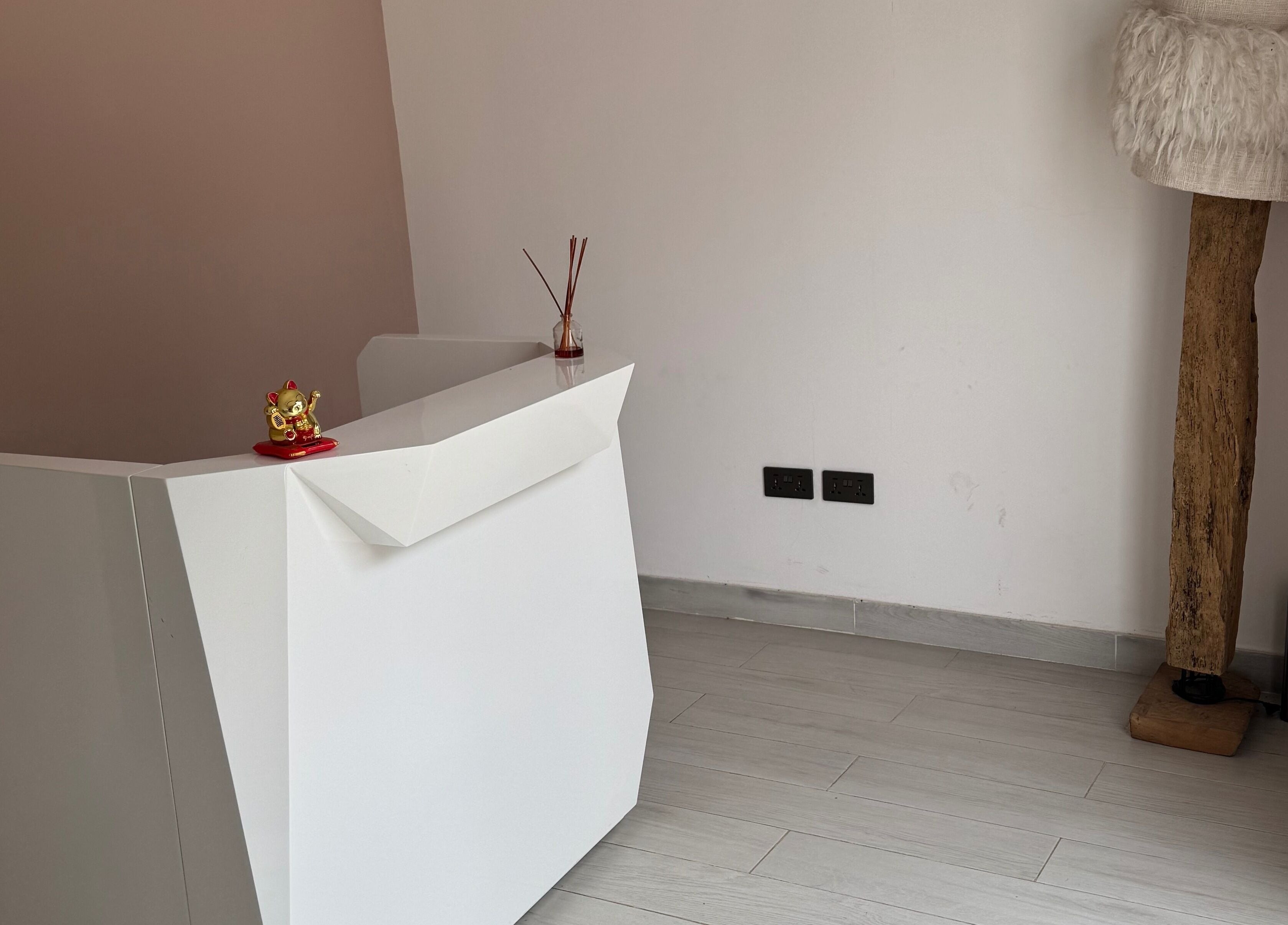 Reception desk at The Wax Lounge Mauritius, Port Louis, Port Louis District, MU with elegant decor.