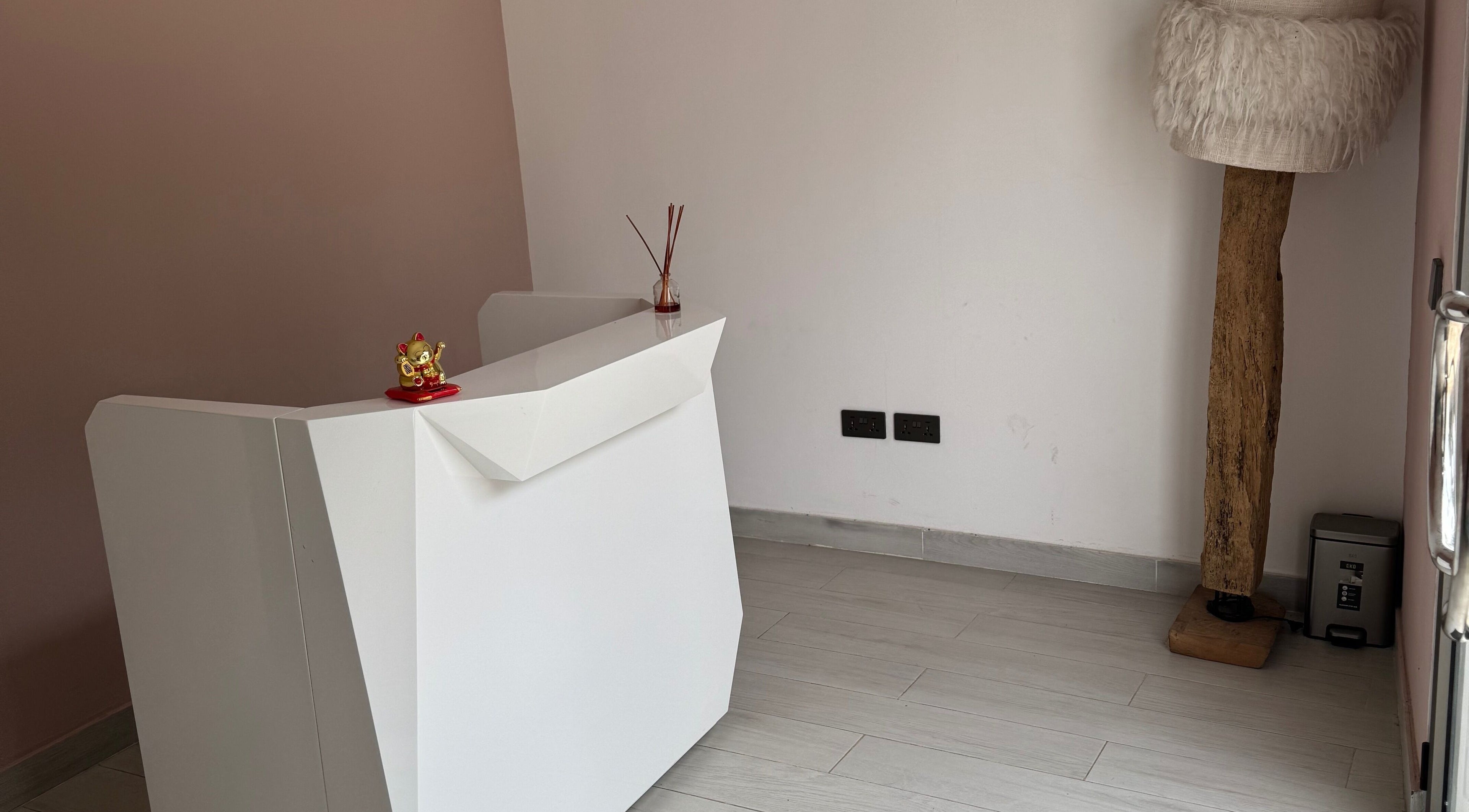 Reception desk at The Wax Lounge Mauritius, Port Louis, Port Louis District, MU with elegant decor.