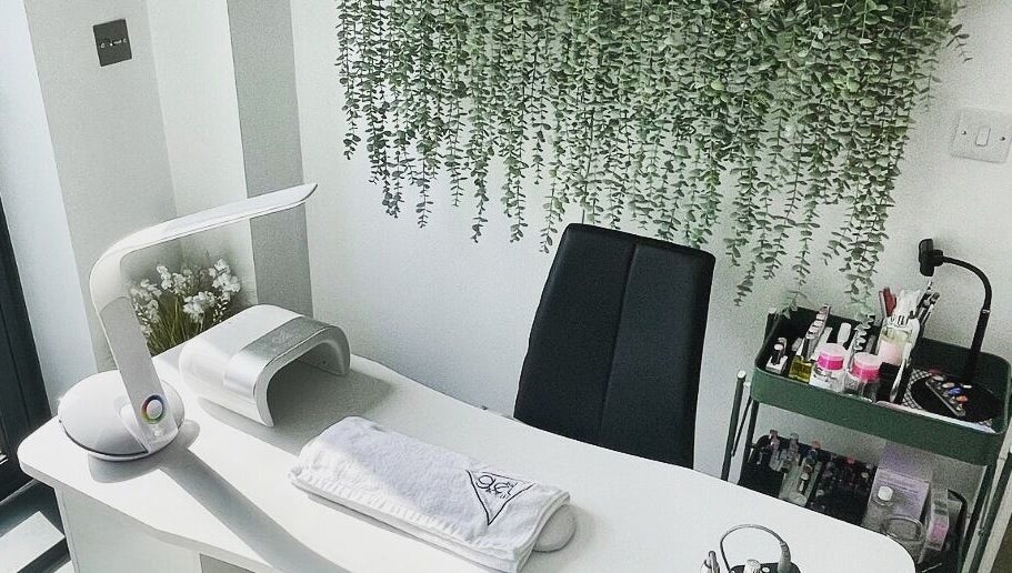 Modern nail station at Painted Nails X Charlotte, Wokingham, England, GB with greenery and sleek decor.
