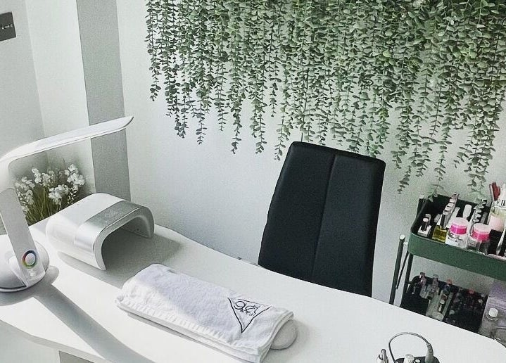 Modern nail station at Painted Nails X Charlotte, Wokingham, England, GB with greenery and sleek decor.