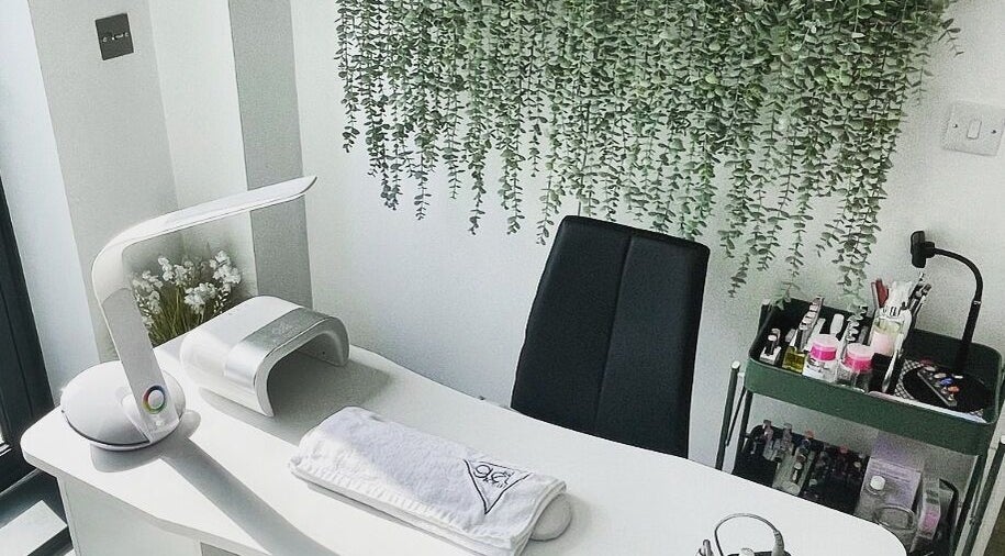 Modern nail station at Painted Nails X Charlotte, Wokingham, England, GB with greenery and sleek decor.