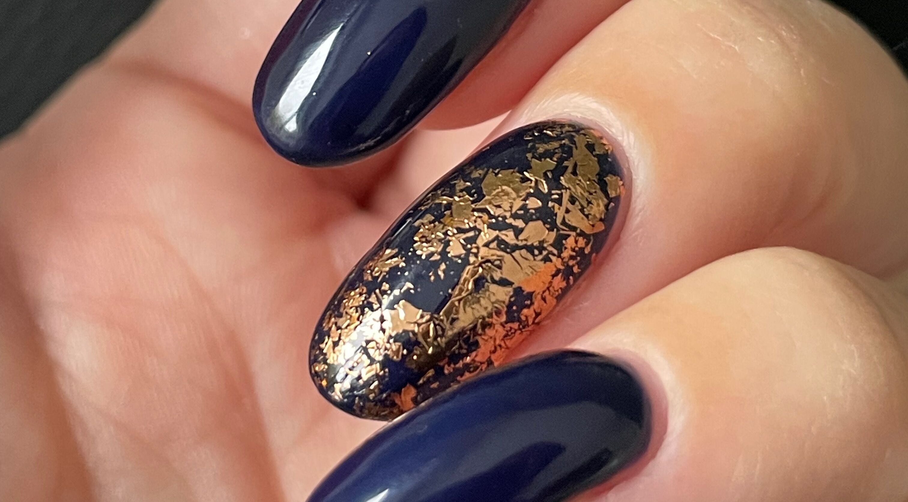 Elegant navy nails with gold flakes at Painted Nails X Charlotte, Wokingham, England, GB.