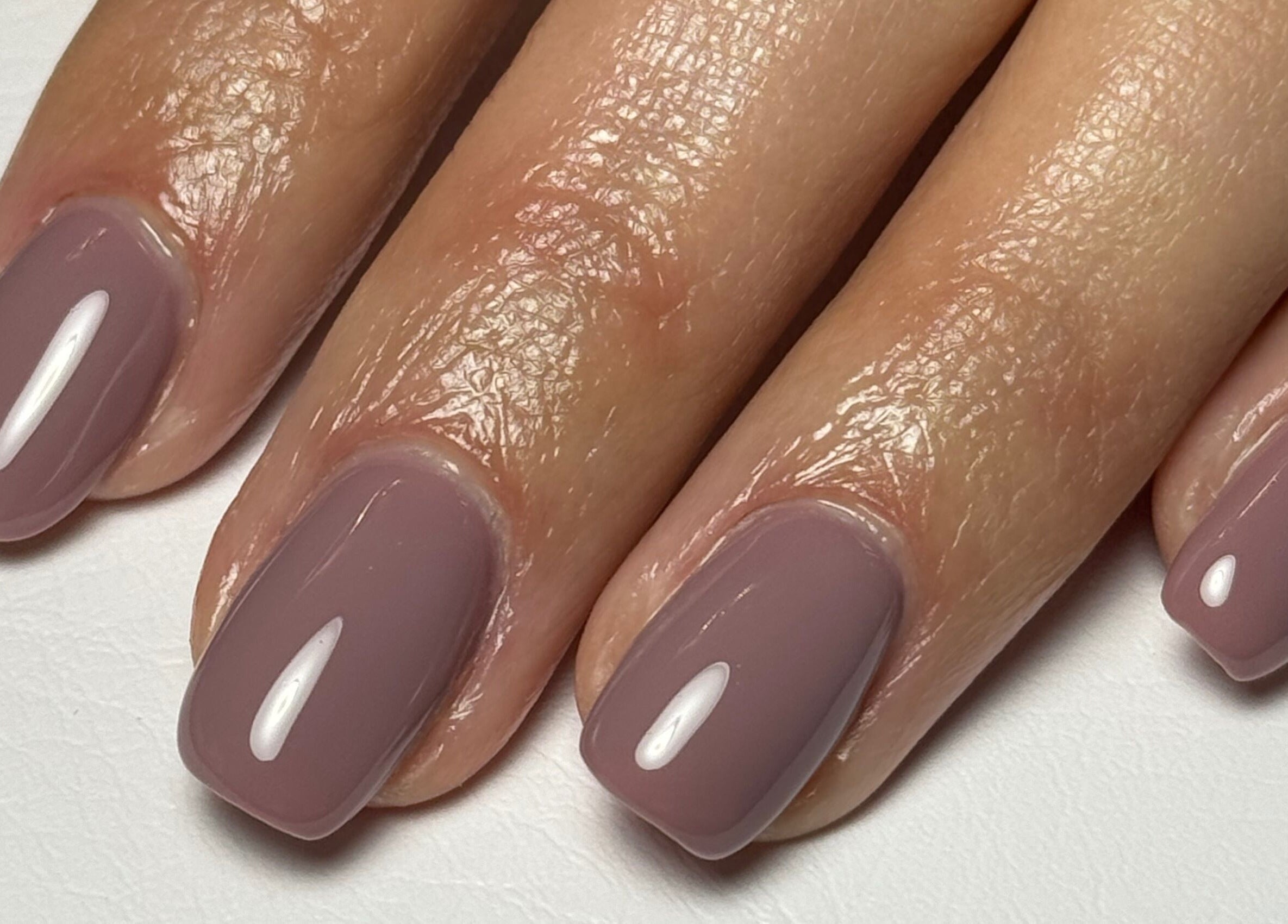 Glossy mauve manicure at Painted Nails X Charlotte, Wokingham, England, GB, showcasing perfect nail finish.