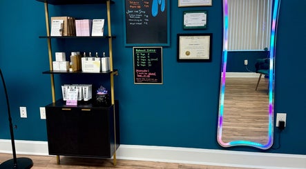 Product shelf and colorful mirror at Crystal Coven Waxing, Alexandria, Virginia, US.