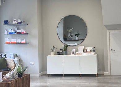 Cozy waiting area at Skinergy by Leona, Manchester, England, GB, featuring elegant decor and skincare products.